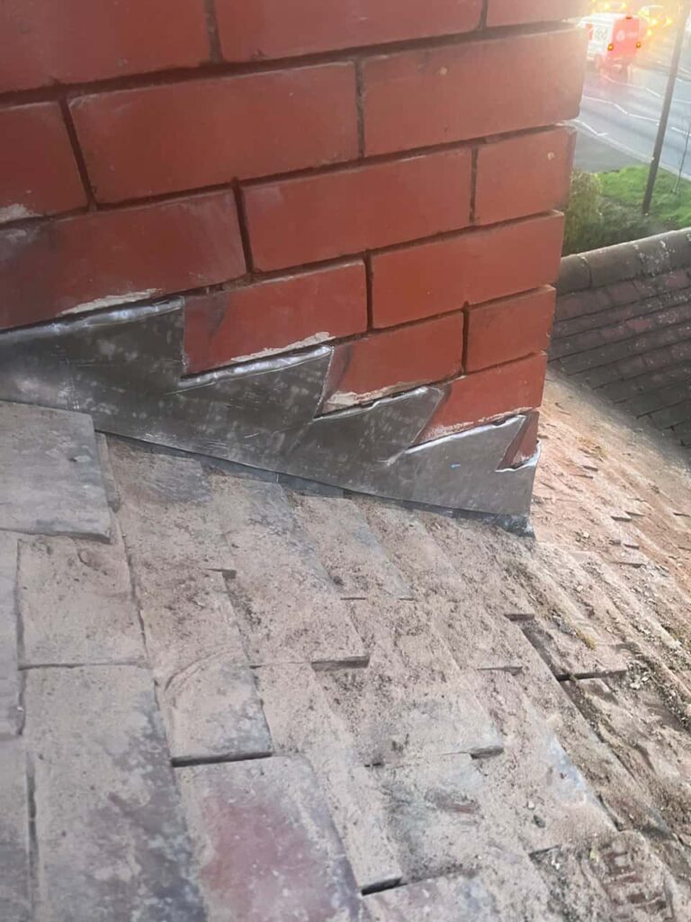 This is a photo of new leadwork being installed around an old chimney. Works carried out by Sawston Roofing Repairs